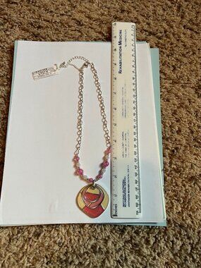 Pink and silvertone necklace